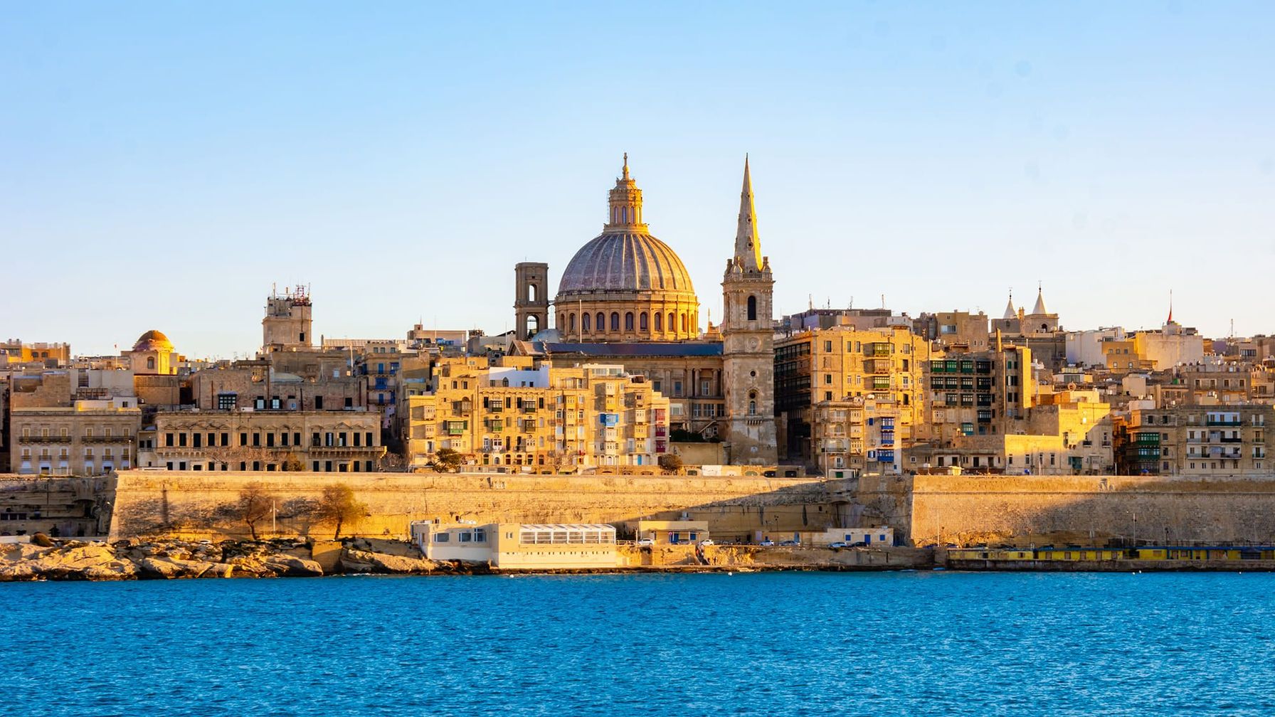 A breathtaking view of Valletta, Malta, with the Basilica of Our Lady of Mount Carmel and St. Paul’s Pro-Cathedral.